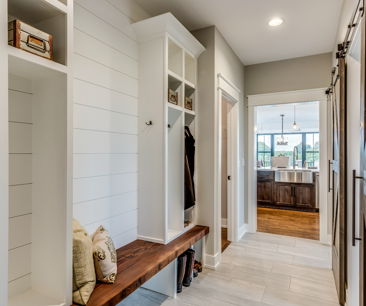 Mudroom with tile flooring